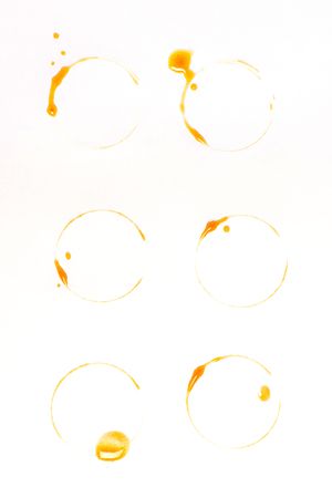 brown coffee stains and drops isolated on whiteの写真素材