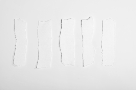 top view of torn empty white note papersの写真素材