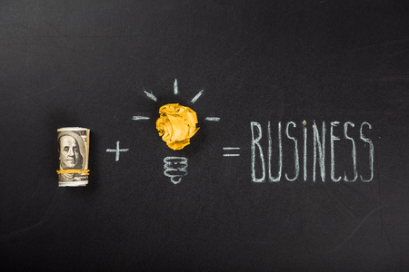 business concept made of light bulb symbol and moneyの写真素材