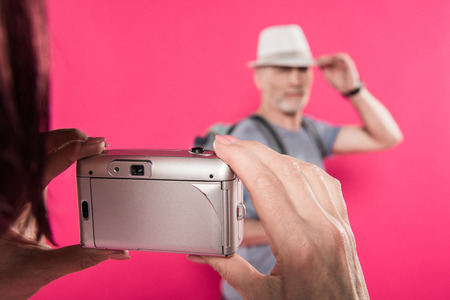 selective focus of woman taking picture of stylish husband