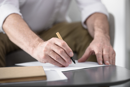 businessman making notes, cropped imageの写真素材