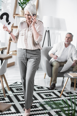 business woman talking on phone in officeの写真素材