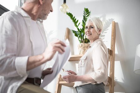 Senior business colleagues converse
