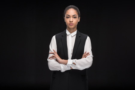 Portrait of confident businesswoman standing with arms crossed and looking at cameraの写真素材