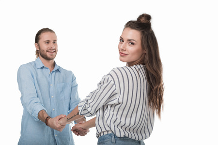young couple holding hands isolated on whiteの写真素材