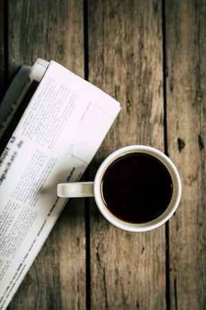 top view of cup of coffee and newspaperの写真素材
