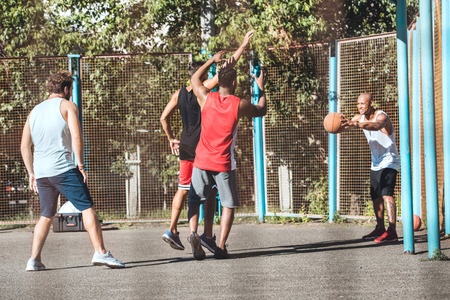 basketball players playing basketball on court