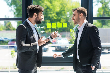 businessmen discussing new project while working in officeの写真素材
