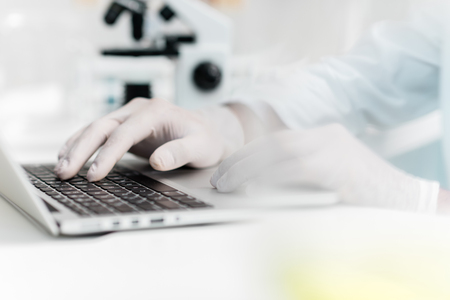 Clscientist using laptop in laboratoryの写真素材