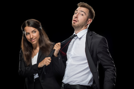 attractive businesswoman flirting with her handsome colleagueの写真素材