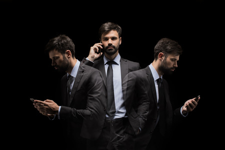 multiple exposure of busy businessman using smartphoneの写真素材