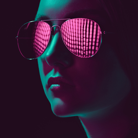 stylish young woman in sunglasses with pink lensの写真素材