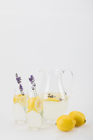 fresh citrus drinks with lavender flowers in glassesの写真素材