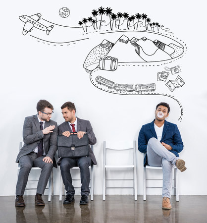 businessmen sitting on chairsの写真素材