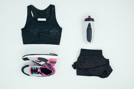 sportswear with sneakers and sports bottle isolated on greyの写真素材