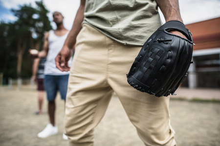young man with baseball glove on handの写真素材