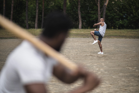handsome men playing baseball on court, selective focusの写真素材