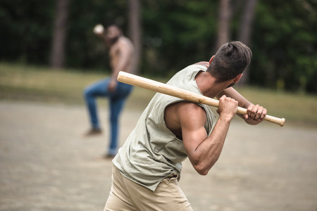 multiethnic men playing baseball on court, selective focusの写真素材