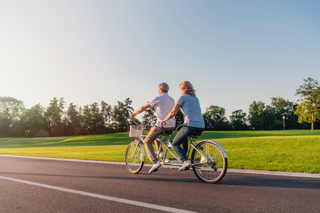 senior couple riding bicycleの写真素材