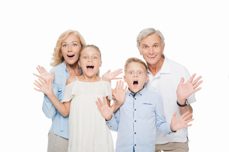 surprised grandparents with grandchildrenの写真素材