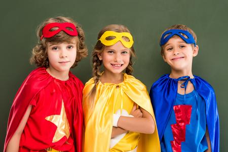 pupils in superhero costumesの写真素材