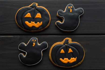 top view of composition of various halloween cookies on black tableの写真素材