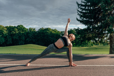 caucasian woman practicing yoga pose