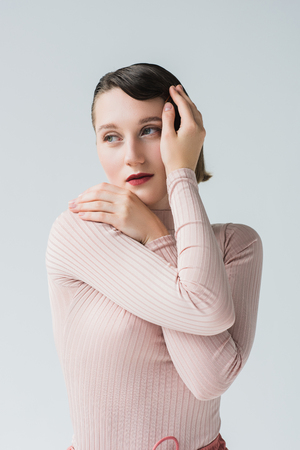 thoughtful woman in retro clothingの写真素材