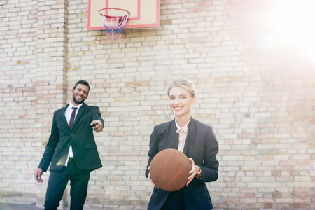 business colleagues with basketball ballの写真素材