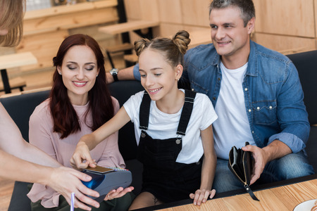 family paying with credit card