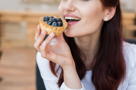 woman eating delicious dessert