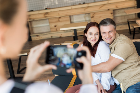 mature couple embracing in cafe