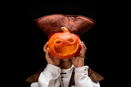 little pirate with jack o lanternの写真素材