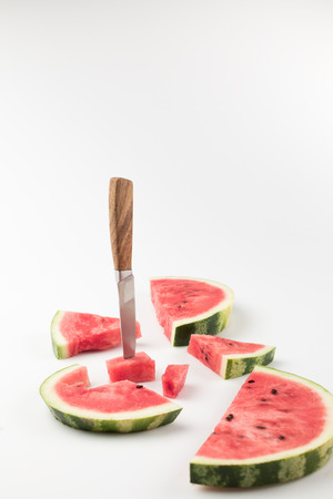 watermelon slices with knifeの写真素材