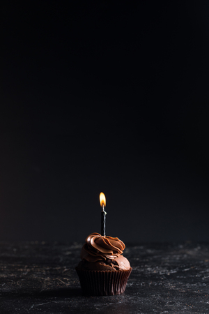 chocolate cupcake with candleの写真素材