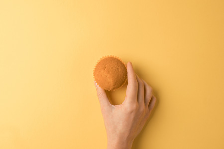 hand holding muffin