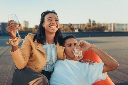 couple with glasses of alcohol