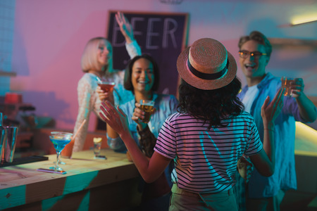 multicultural people greeting friend at partyの写真素材