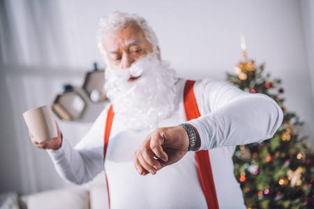 santa claus checking timeの写真素材
