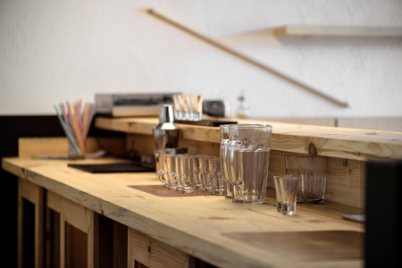 clean empty glasses on wooden bar counterの写真素材
