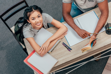 multiethnic students doing homeworkの写真素材