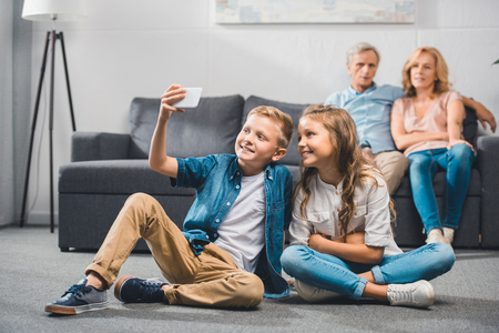 siblings taking selfieの写真素材