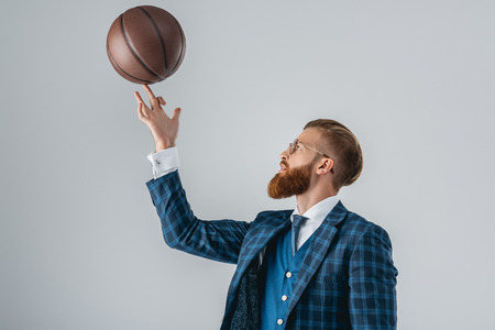 handsome man in suit with basketball ballの写真素材