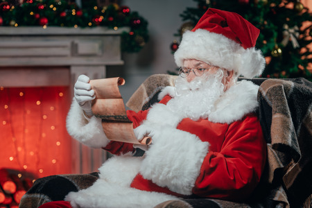 santa claus holding listの写真素材