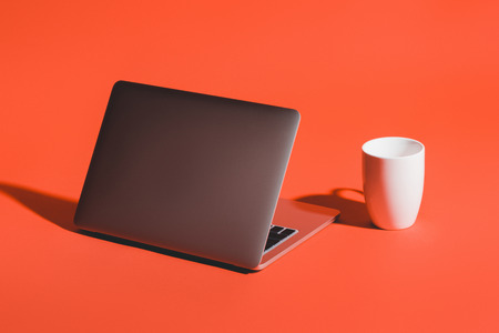 cup of coffee and laptopの写真素材