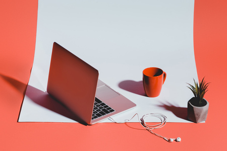 coffee, laptop with earphones