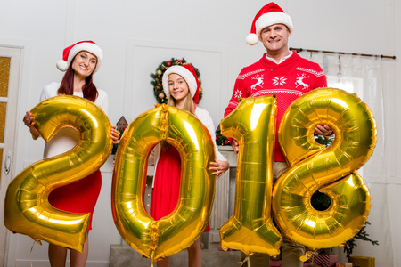 family with new year balloonsの写真素材