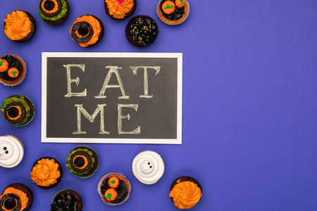halloween cupcakes and eat me inscriptionの写真素材