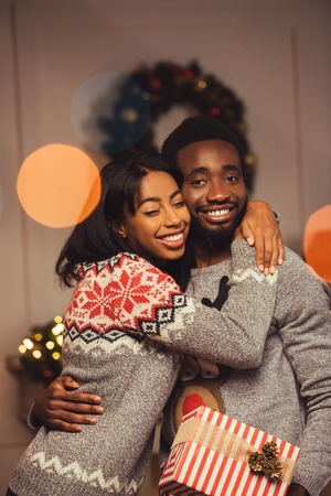 happy african american couple on christmasの写真素材