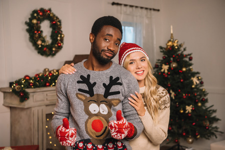 multiethnic couple on christmas eveの写真素材